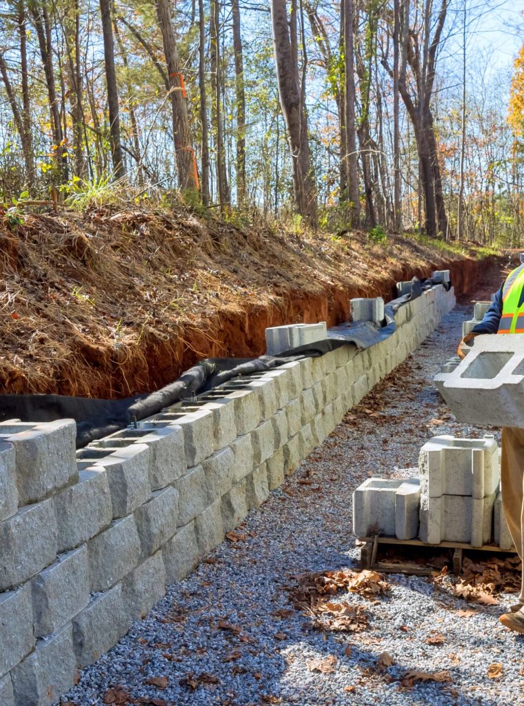 Contractor installed mounted concrete block retaining a walls Contractor installed mounted concrete block retaining wall
